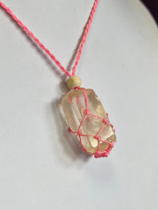 Pink macrame web holder necklace with high grade calcite